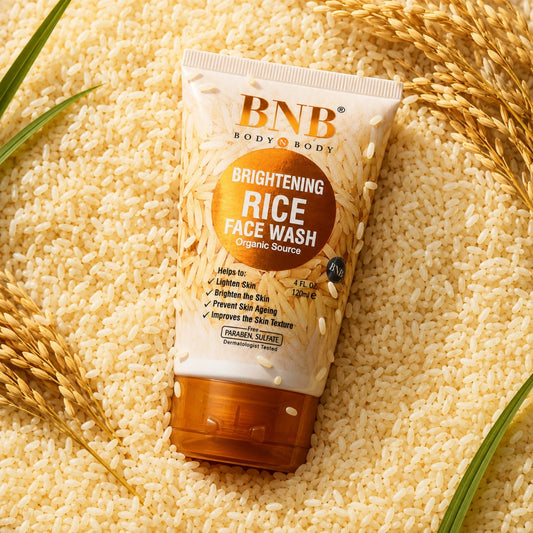 BNB Brightening Rice Face Wash surrounded by rice grains and wheat in a premium skincare product shot